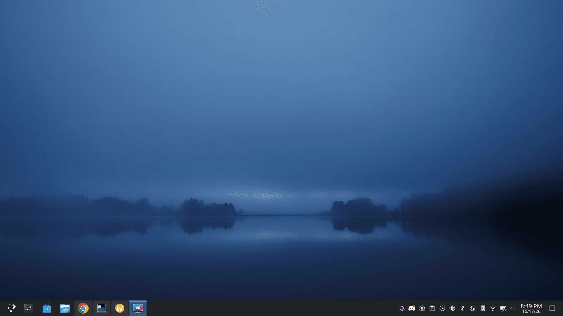 Gautam's Fedora KDE desktop: a misty blue lake wallpaper with the Plasma panel along the bottom